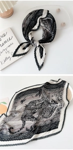 Detail of pleated square silk scarf with black and white leopard pattern in professional layout