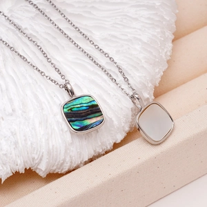 18K gold plated copper necklace featuring square abalone and white mother of pearl pendants