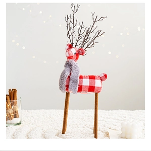Detail of red and white plaid reindeer ornament with grey faux fur scarf and branch antlers