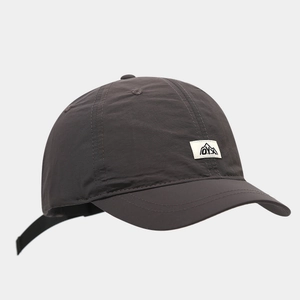 Detailed view of dark grey waterproof baseball cap with mountain patch and adjustable strap
