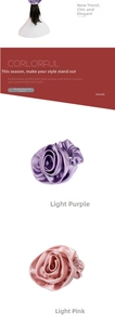 Detail of silk-like satin rose flower hair scrunchie with smooth glossy texture