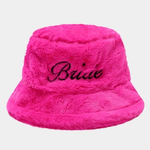 Detail of rose pink faux fur bucket hat with black Bride cursive embroidery for bridal party