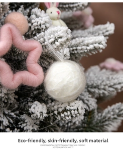 Macro detail of soft pink star and white plush balls Christmas decorative ornaments