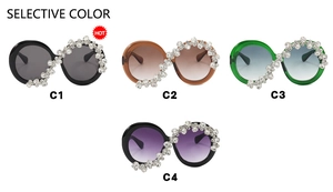 Detailed flat lay of oversized round sunglasses featuring crystal embellishments in four colors