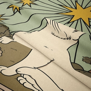 Close-up of soft plush fabric texture with vintage cat and star illustration detail