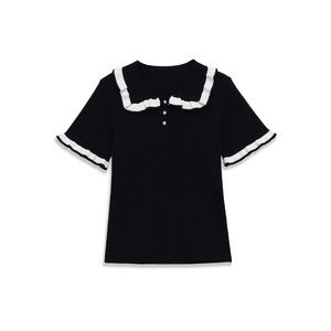 Women's black short sleeve knit polo shirt with white ruffle trim and collar
