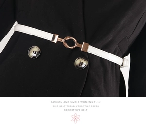 Close-up of white thin waist belt with golden metal buckle on black double-breasted coat