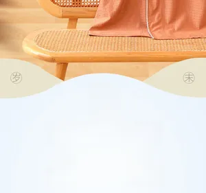 Close-up of orange waffle texture fabric on a rattan chair for home loungewear