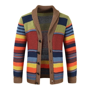 Close-up of color block knit cardigan featuring textured stripes and shawl collar detail