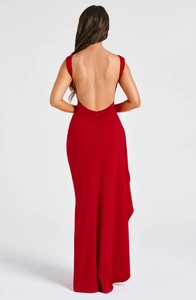 Detail of red backless evening dress with slim fit cut and deep U-shaped open back design