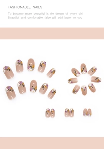 Macro view of floral pattern press-on nails set with elegant nude pink base color