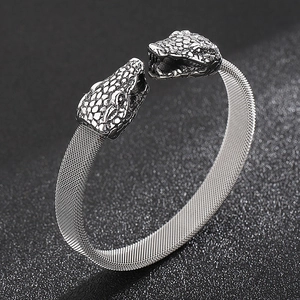 Detailed close-up of double snake head stainless steel mesh bracelet with scale texture