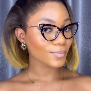 Detail of model wearing TR90 cat eye glasses frames with black and tortoise shell pattern
