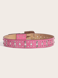 Close-up of pink leather belt with silver butterfly buckle and metal star studs