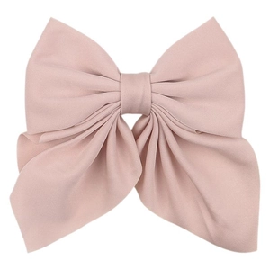Pink fabric bow hair clip with textured ribbon design for women on white background