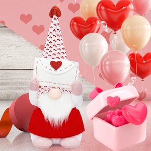 Close-up of Valentine gnome with a red polka dot hat holding a heart envelope