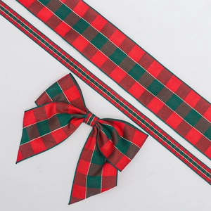 Detail of red and green plaid Christmas ribbon with gold stitching and pre-made DIY bow