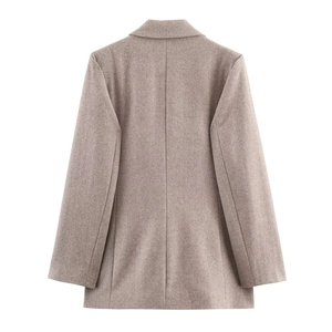 Back view of a tailored herringbone wool blazer in warm taupe with clean seam lines