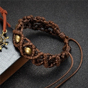 Handmade woven dark brown bracelet with brass metal beads and adjustable drawstring