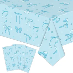 Light blue tablecloth detail with navy blue bows and white star patterns for parties