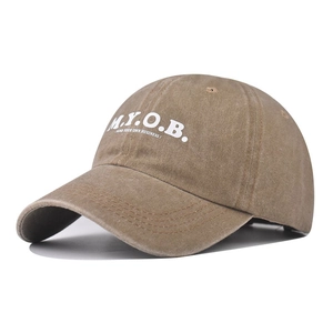 Brown vintage washed cotton baseball cap featuring white M.Y.O.B. embroidery detail