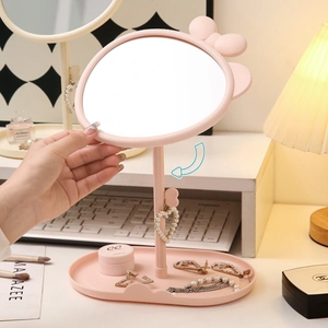 Pink desktop makeup mirror with cute ears and storage base, adjustable rotation angle