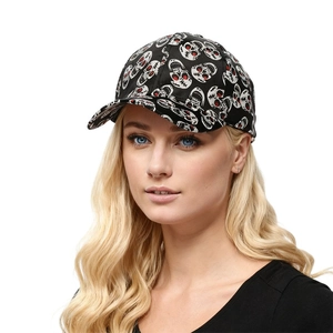 Close-up of model wearing black baseball cap with white skull prints and red details