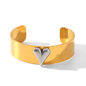Polished 18k gold stainless steel cuff bracelet featuring a 3D silver heart contrast detail