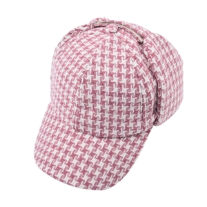 Close-up of pink houndstooth baseball cap featuring thick wool texture and warm earflaps