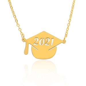 Detailed close-up of a polished gold graduation cap necklace with 2021 pendant engraving