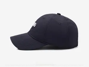 Detail of the quick-dry baseball cap featuring side embroidery and breathable eyelets