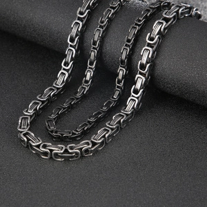 Detail of vintage Byzantine stainless steel king chain with oxidized silver finish