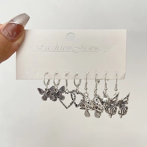 Silver retro earring set featuring heart, butterfly, snake, and mushroom designs