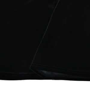 Close-up detail of the hemline and stitching on a black velvet slim fit dress