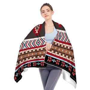 Detail shot of microfiber beach towel featuring geometric tribal prints and soft fringe edges