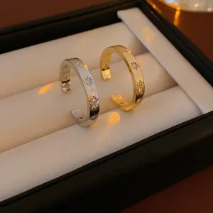 Brushed star zircon open ring set in gold and silver finish with sparkling star details