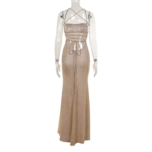 Detail of shimmering champagne evening dress featuring a sexy backless cross-strap design