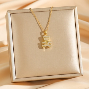 Golden bear pendant necklace with micro-pave zircons on a luxury silk background