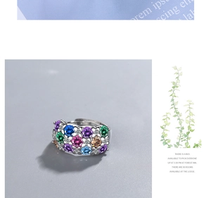 Macro detail of silver vintage flower ring with colorful cubic zirconia and multi-gemstones