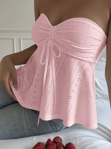 Pink lace tube top with drawstring detail and cut-out design for a slim summer fit