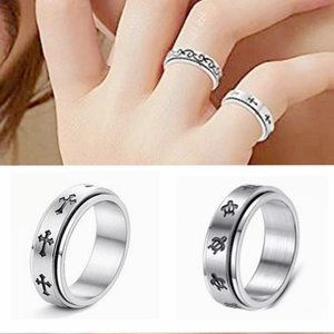 Detail of spinner ring showing silver cross and celtic knot patterns for anxiety relief