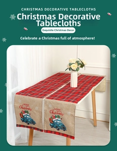 Close-up of rustic Christmas table runner with blue truck design on linen and plaid fabric