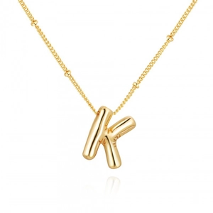 Elegant gold letter K pendant necklace with beaded chain on a white background