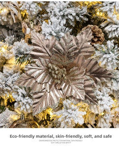 Close-up of glittery champagne gold poinsettia flower on a decorated Christmas tree