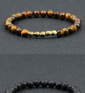 Detail of tiger eye and lava stone beads with irregular golden metal spacers