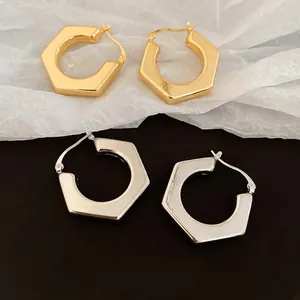 Polished geometric hexagonal hoop earrings in gold and silver finish for women
