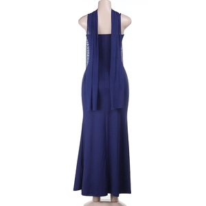 Detail view of the deep blue back design and flowing cape of the maxi dress