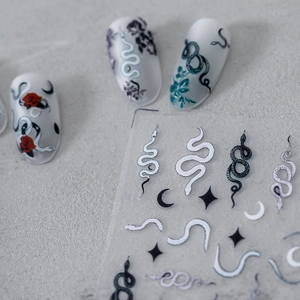 Matte Japanese nail stickers featuring snake, red rose, moon, and star designs
