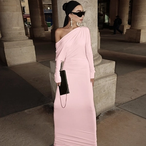 Detail view of pink off-shoulder long-sleeve dress with elegant draping and slim fit style
