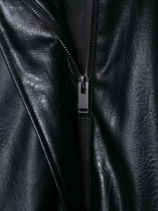 Detail of premium black faux leather texture and gunmetal zipper on the aviator jacket